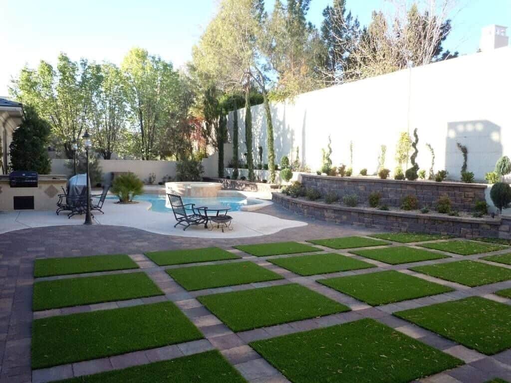 Artificial lawn in between pavers