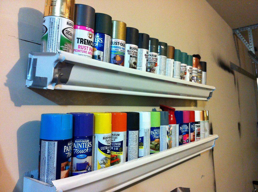 A variety of spray cans stored in racks