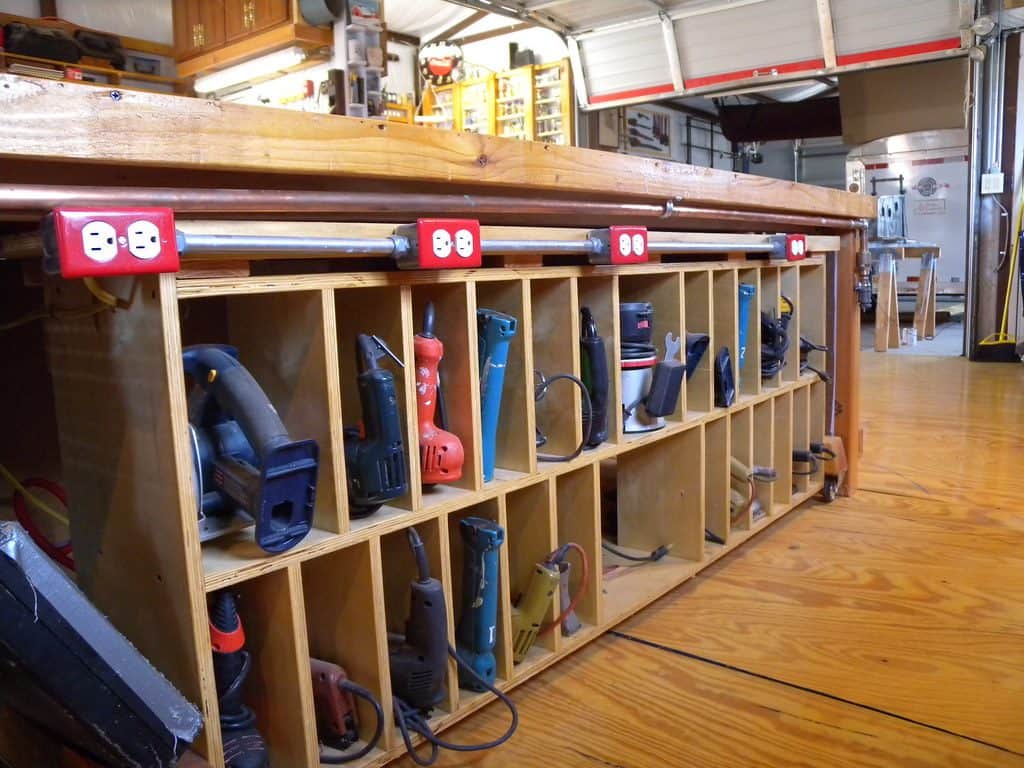 Power tools inside an open cabinet storage