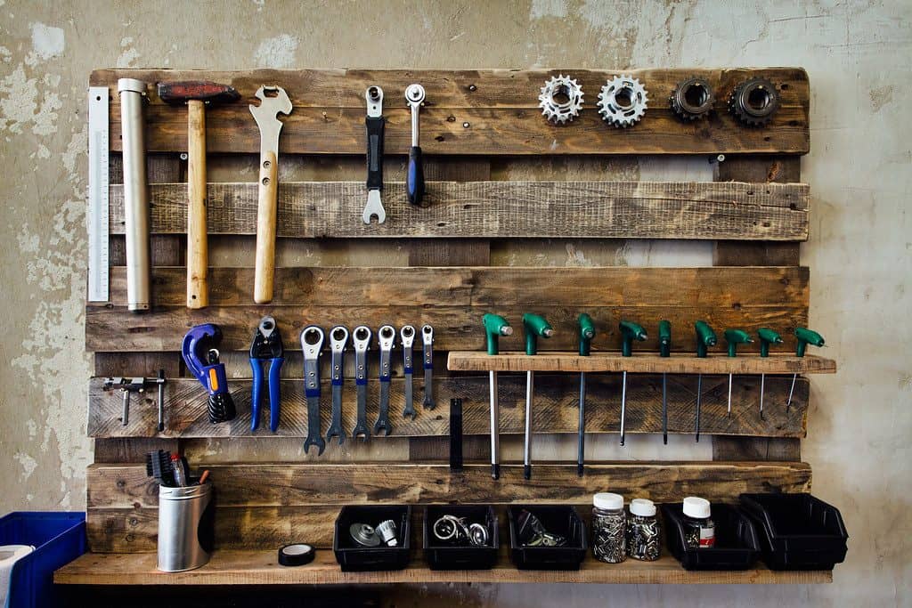 Hanging pallet tool storage with various of DIY hand tools