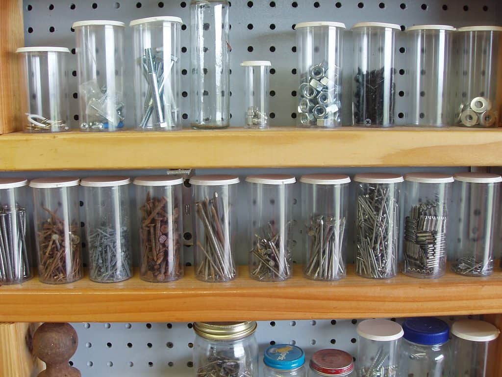 Various nails and screws stored in mason jars