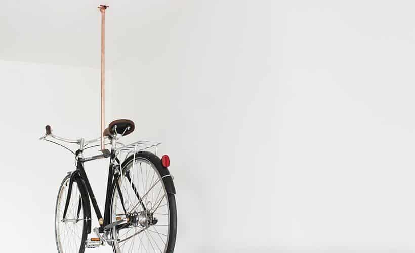 Suspended copper pipe bike hanger