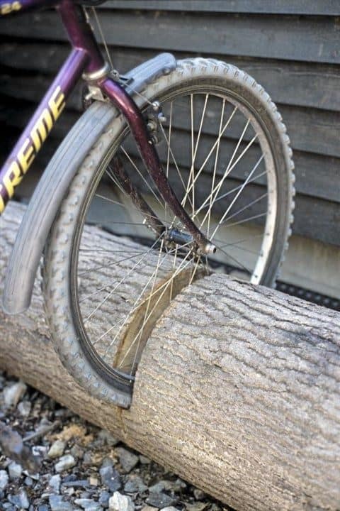 Backyard bike rack made from a tree trunk