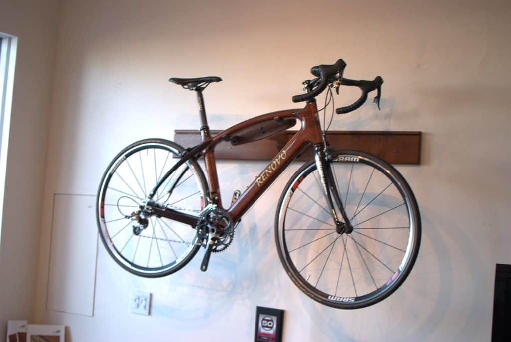 A bike on a DIY wooden bike hanger