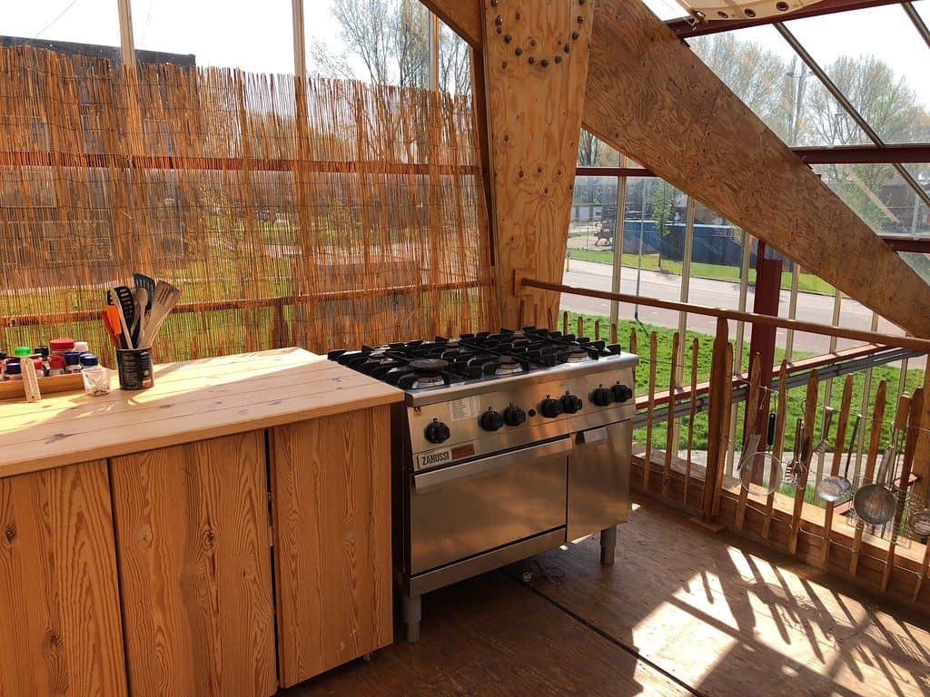 An outdoor kitchen workstation setup accompanied by a gas stove.