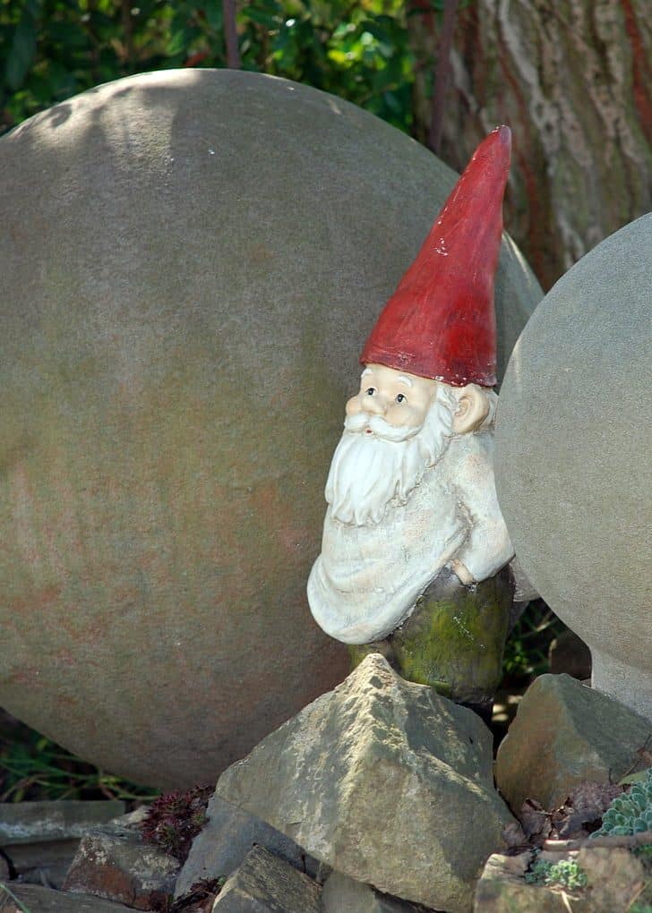 A gnome in between rocks
