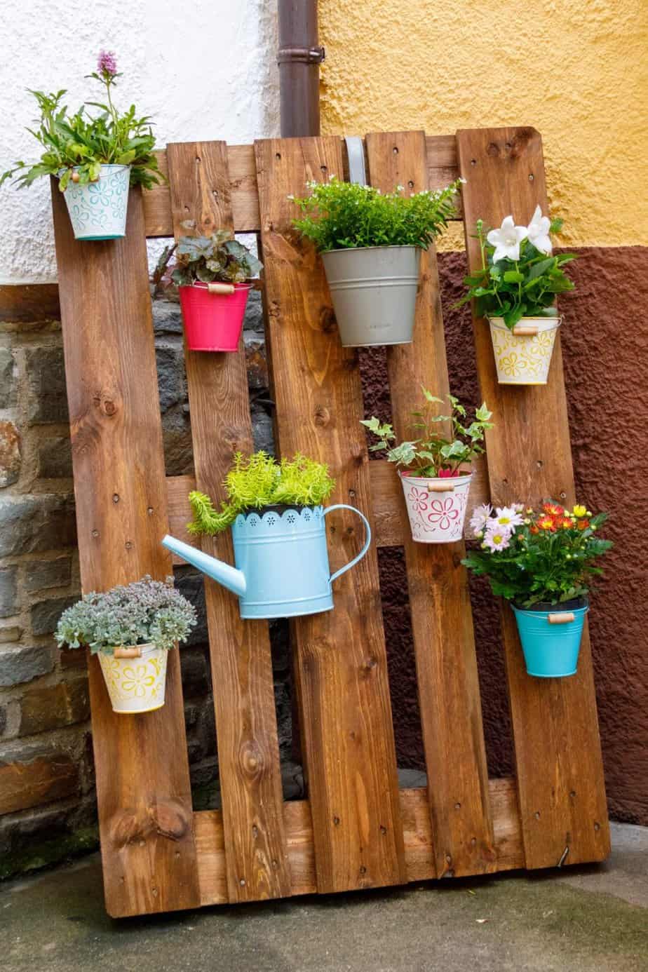 DIY pallet planters with various plant pots