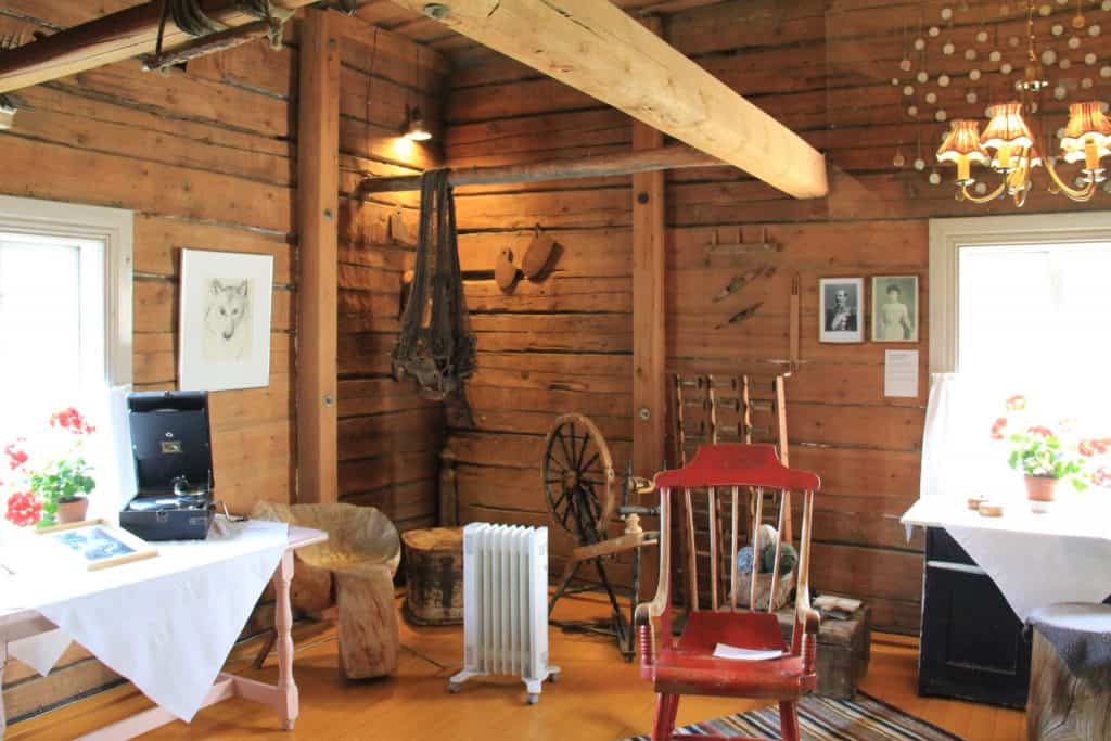 Classic log cabin with vintage furniture and an electric convectional heater