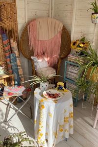 Summerhouse interior with cosy wicker furniture