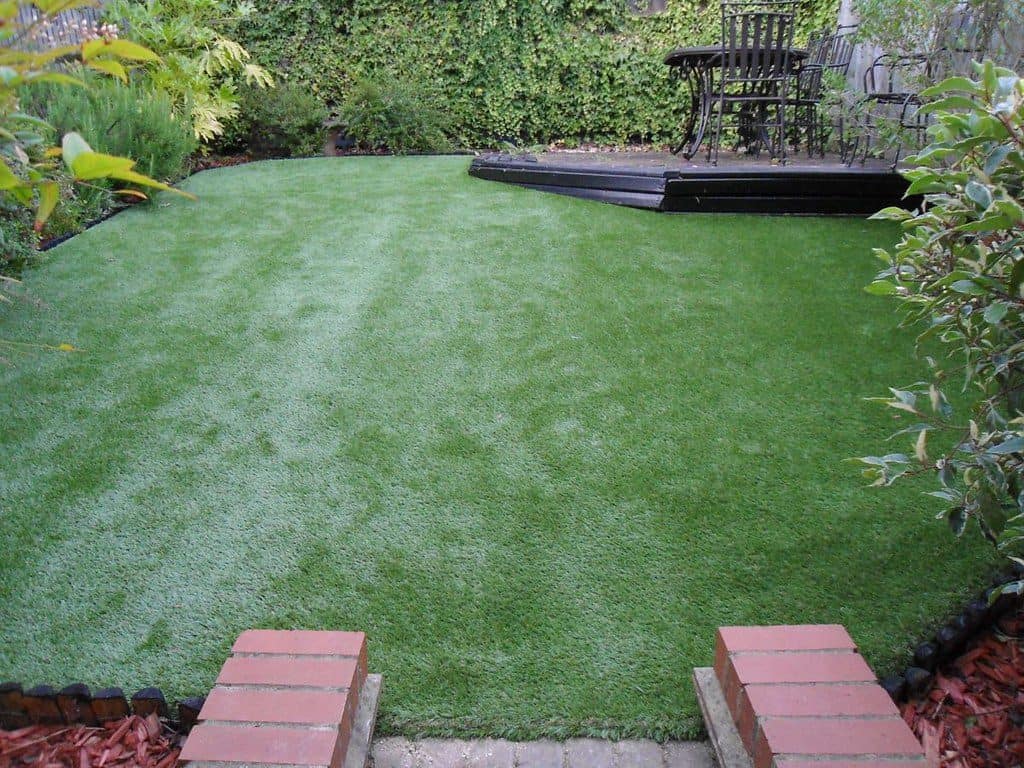 Small backyard with artificial lawn