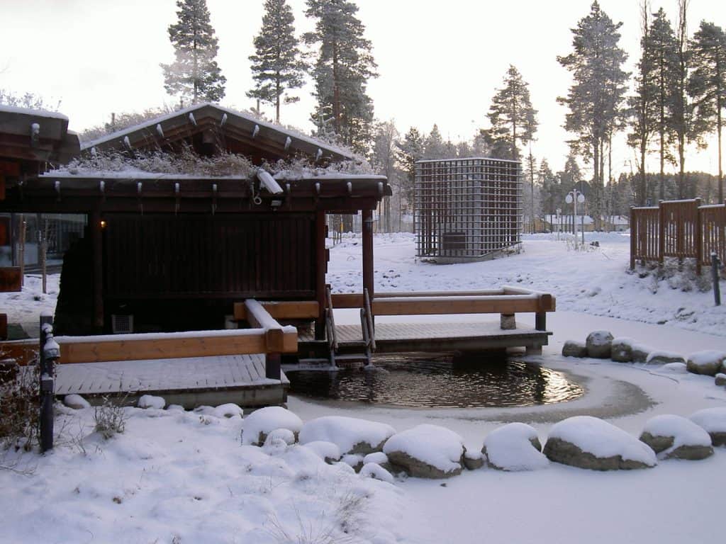 Outdoor steam bath surrounded by snow