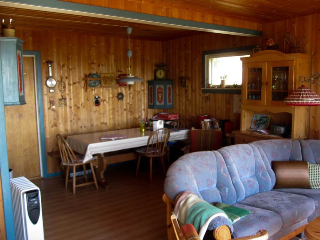 Inside a log cabin in wintertime, with oil-filled heater