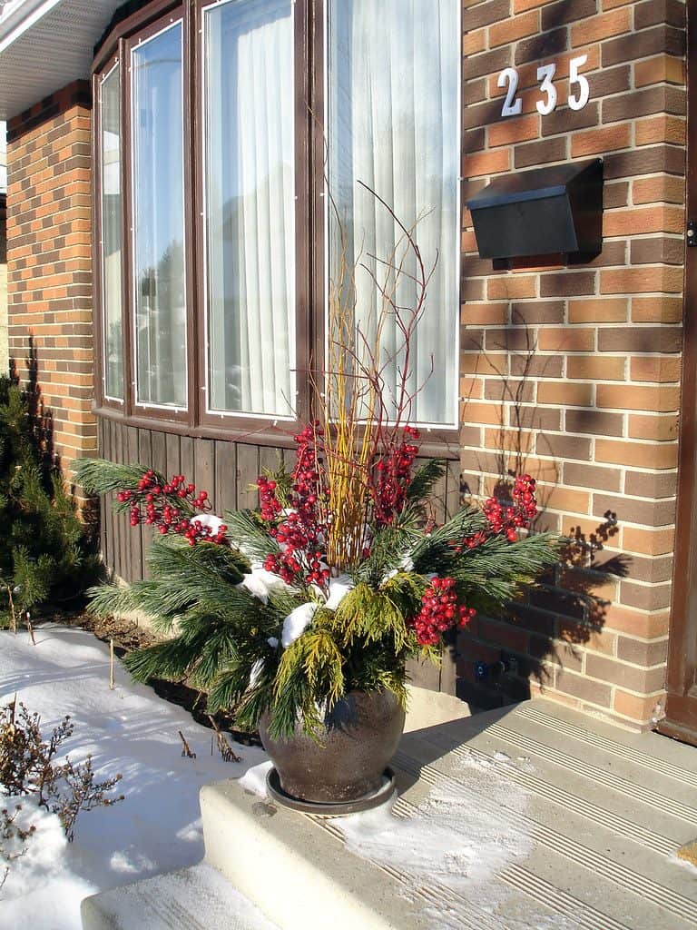 Christmas container garden display in front porch