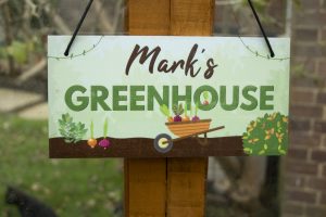 Graphic sign with the text "Mark's Greenhouse"