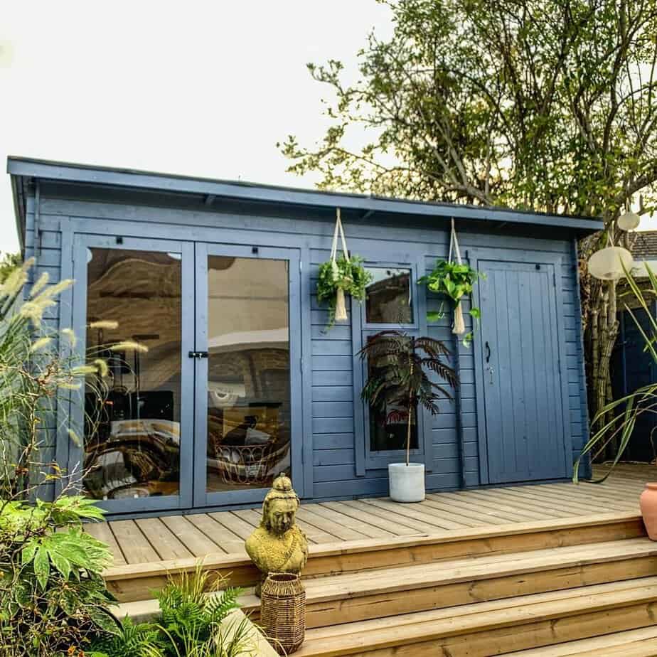 One of our customers showing off their freshly painted log cabin.