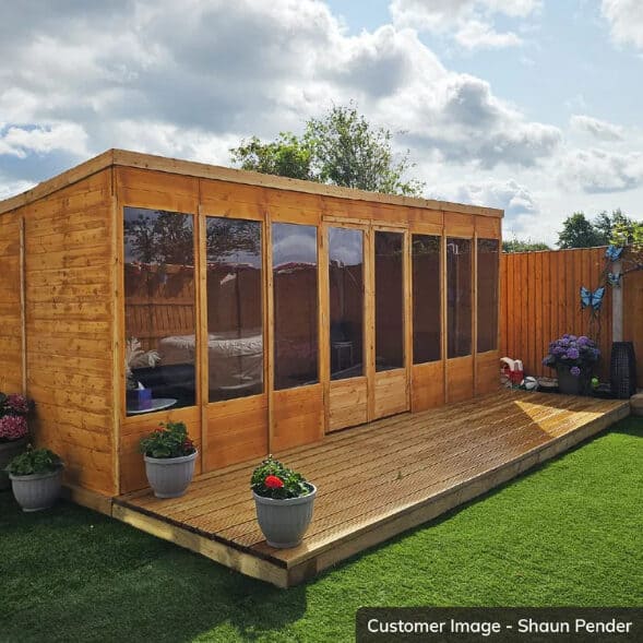 Wooden summerhouse garden room with a pent roof