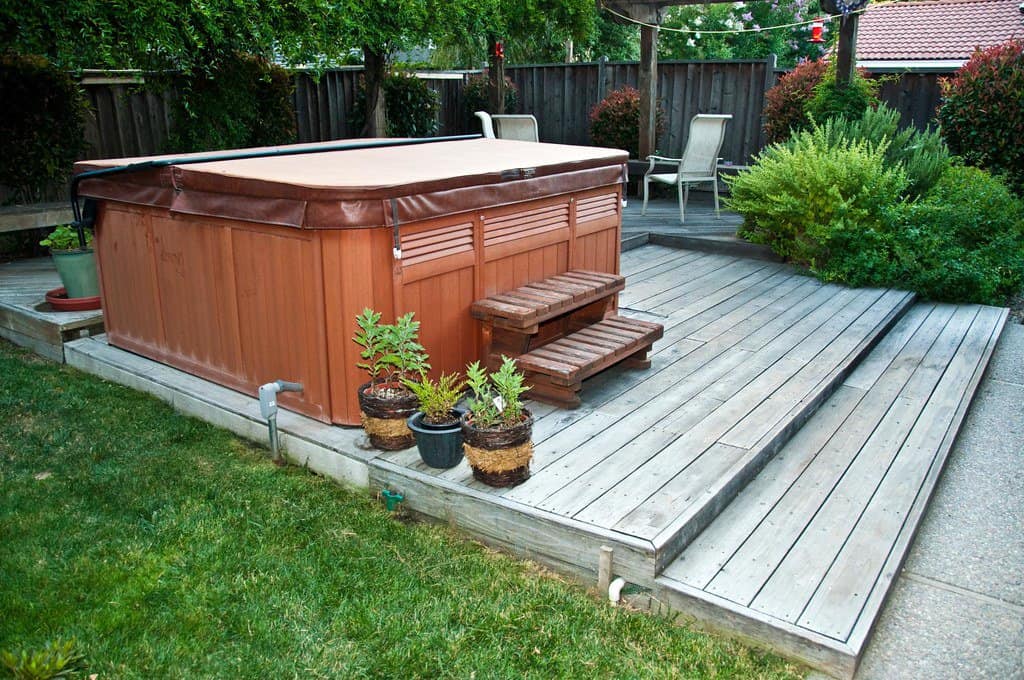 Outdoor hot tub on a garden deck