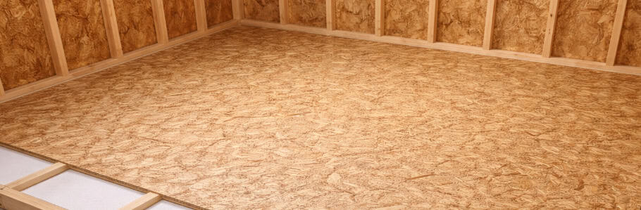 False floor installation on a wooden shed