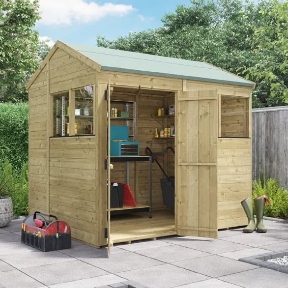 The BillyOh Switch Pressure Treated Apex Shed, on concrete slabs with custom-placed double doors.
