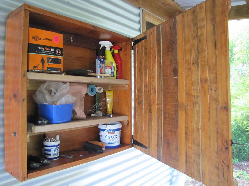 Wooden cupboard repurposed as storage cabinet.