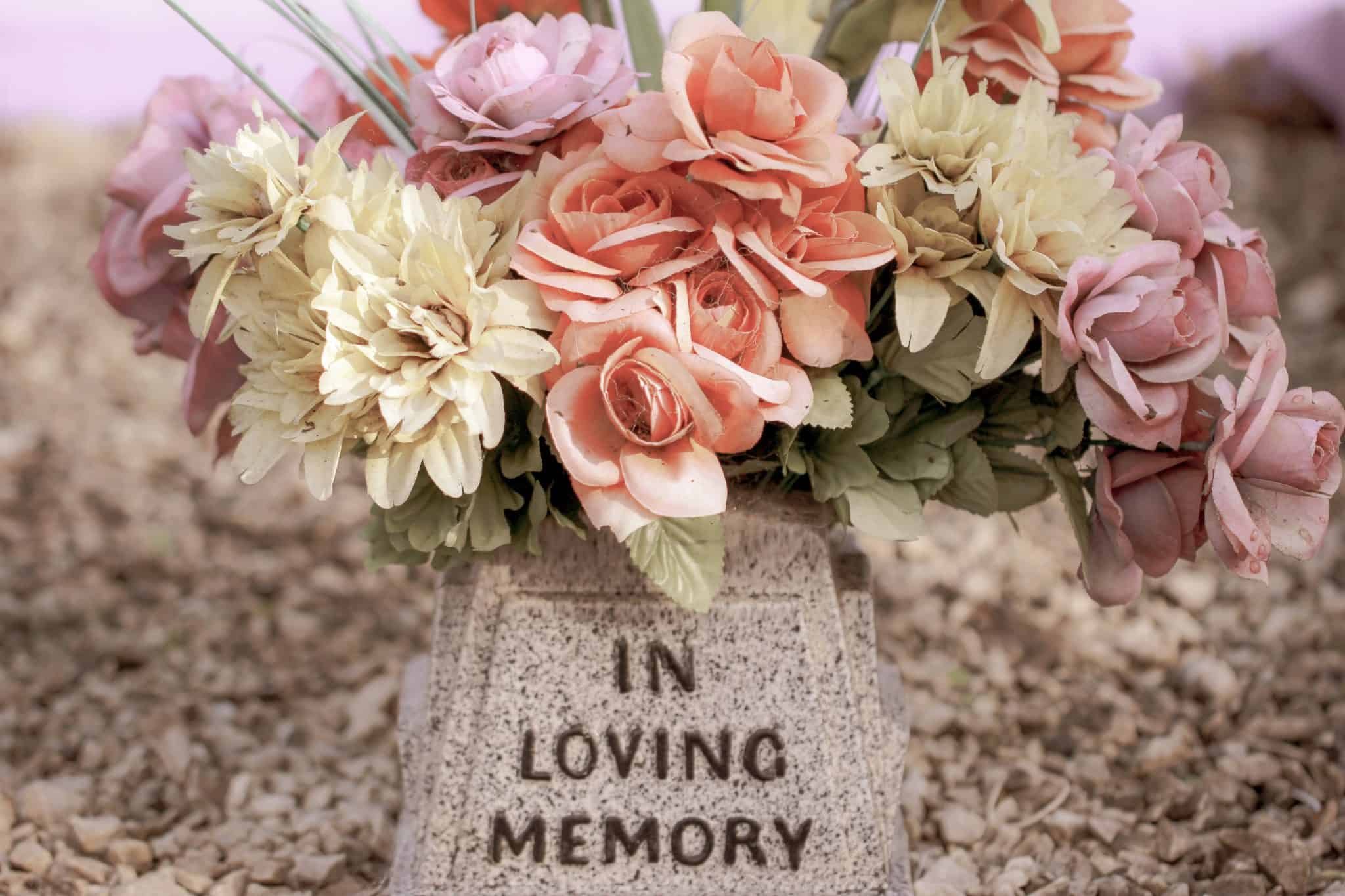 In Loving Memory memorial with flowers