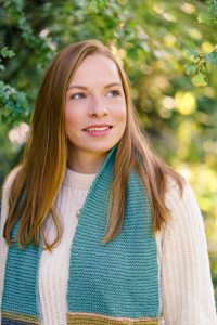 Annabelle Padwick wearing a scarf looking off into the distance