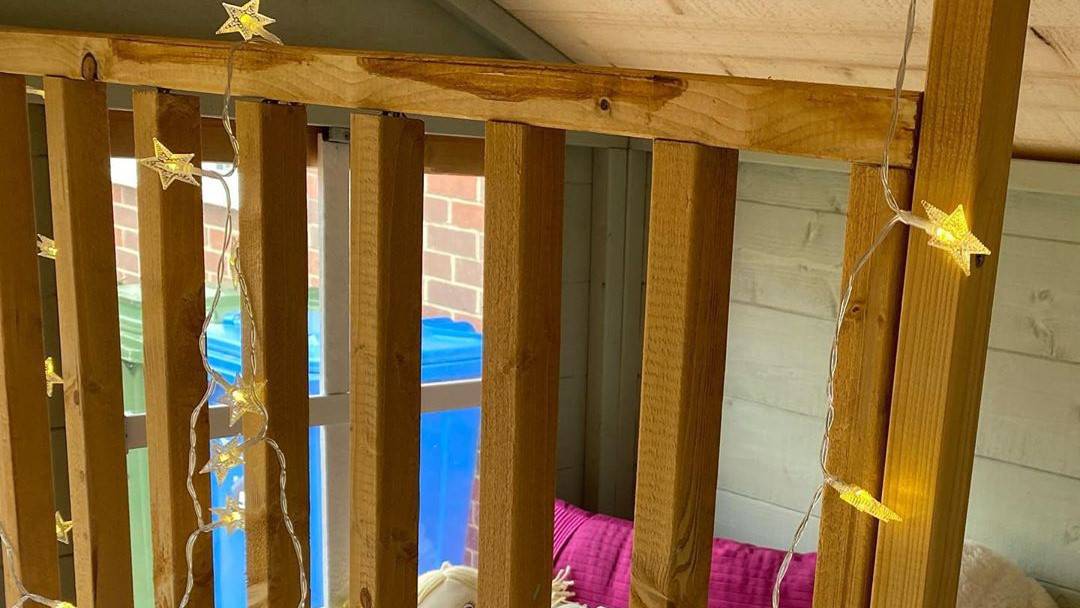 interior playhouse bunk with star shaped fairy lights