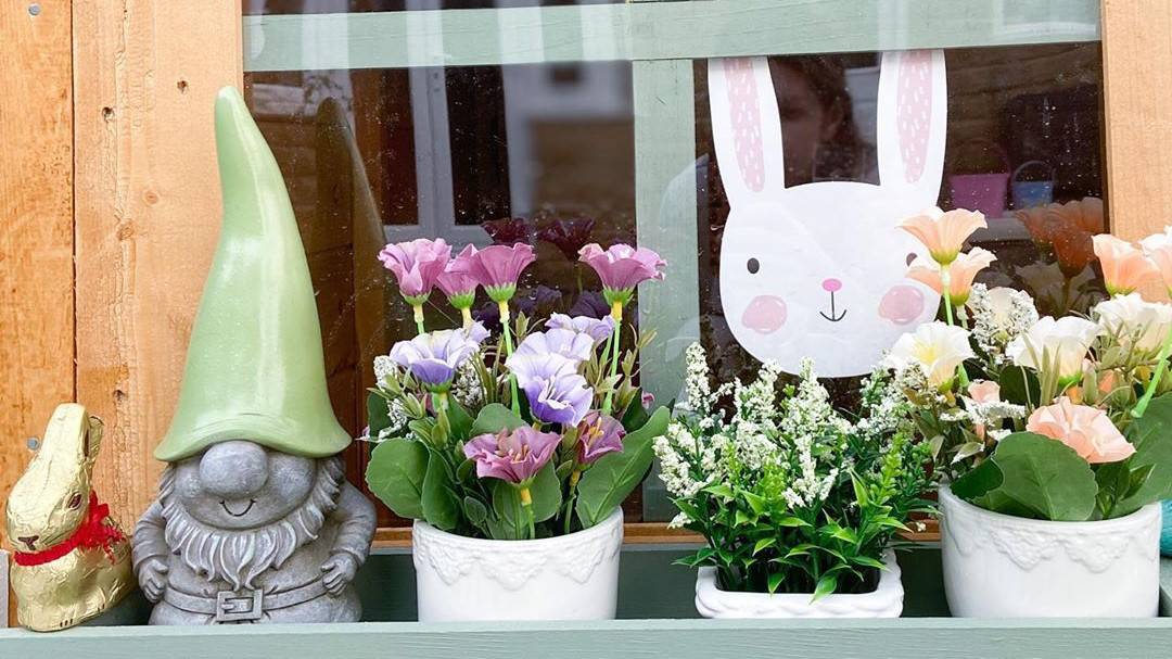 playhouse windows with planter box, gnome and bunny in the window