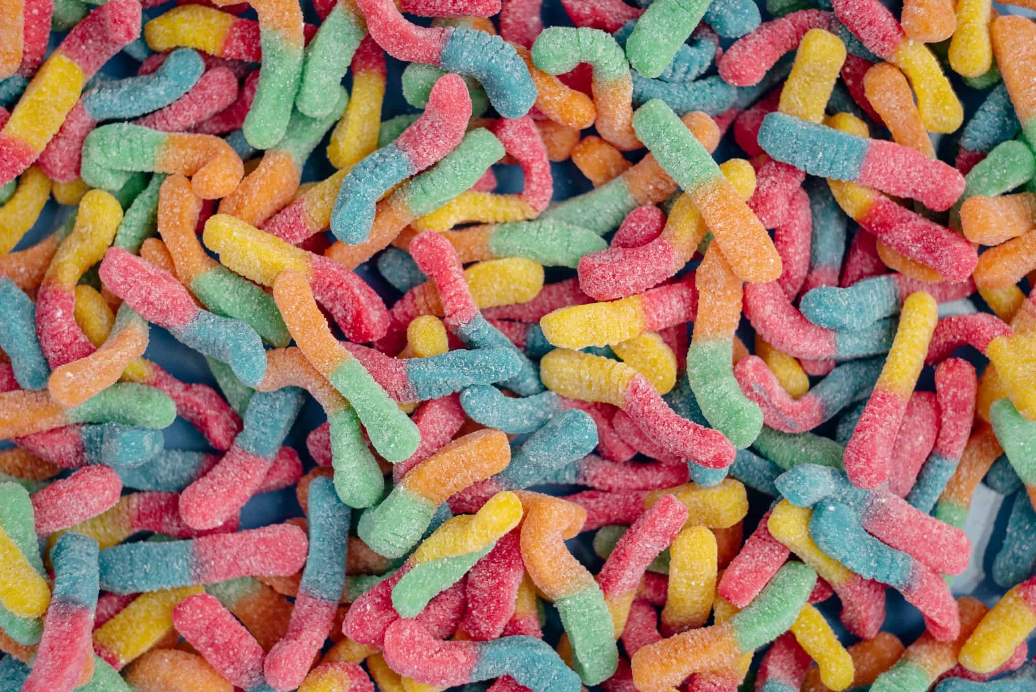 multi-coloured gummy worms in a pile